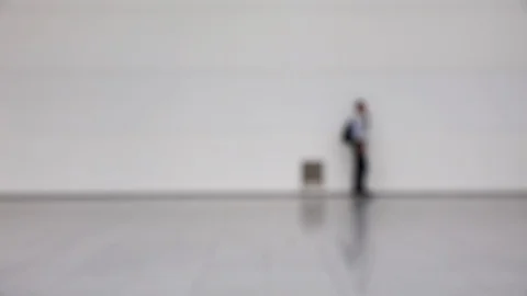 Blurred crowd of people walking by at a trade convention Stock Footage 122204117