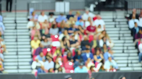 Blurred crowd of spectators sitting in stadium stands during large public event Stock Footage 337983829