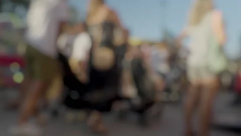 A blurred crowd walking at a funfair Stock Footage 209303616