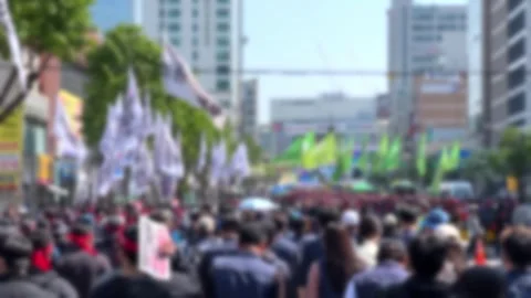 Blurred, crowds holding flags and marching in opposition Stock Footage 241709665