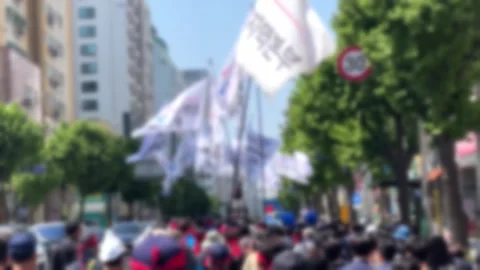 Blurred, crowds holding flags and marching in opposition Stock-Footage 241709667