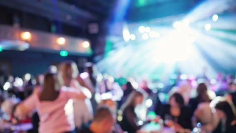 Blurred dance floor with multicolor lights, DJdriven party scene, dancing 스톡 동영상 330292873