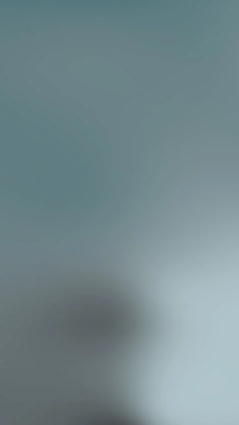 Blurred dark shape on blue gray gradient background Video stock 336952025