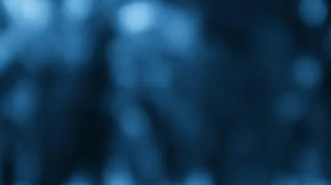 Blurred deep blue botanical background with light reflections Foto stock