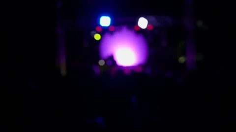 Blurred, defocus background of silhouettes of crowd of people dancing 库存影片 134728333