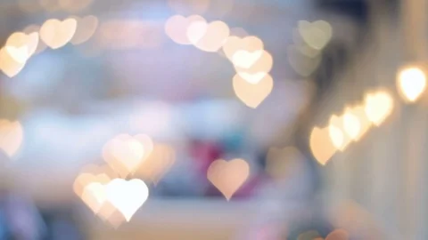 Blurred (defocus effect) indoor scene with bokeh light as heart shape Stock Footage 82411648