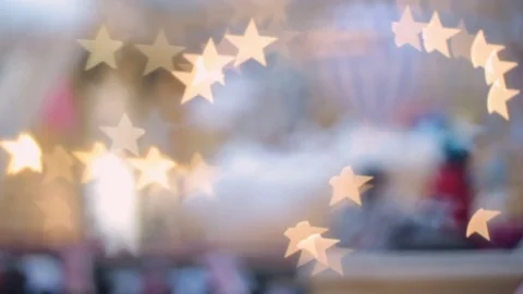 Blurred (defocus effect) indoor scene with bokeh light as Christmas star Stock Footage 82411667