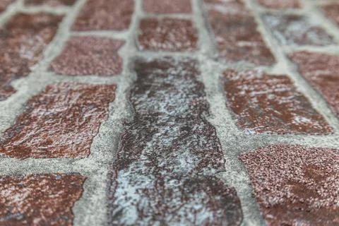 Blurred defocused background of textured wallcovering surface with brick pattern Stock Photos