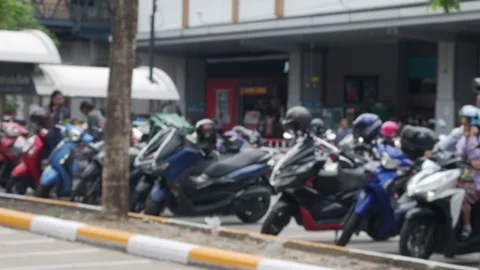 Blurred Defocused Crowded Motorcycle Parking Lot with Trees 库存影片 339859801