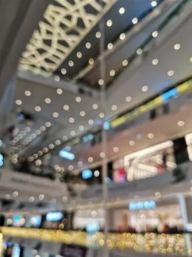 Blurred defocused image of beautifully decorated surrounded by festive lights Stock Photos