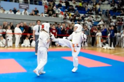 Blurred defocused image with two karate practitioners sparring on a tatami ma Stock Photos