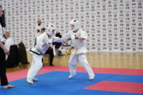 Blurred defocused image with two karate practitioners sparring on a tatami ma Stock Photos