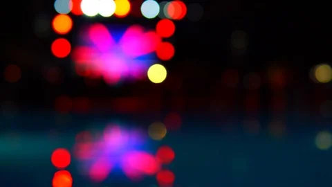 Blurred, defocused night pool party. Color lights reflections in the pool sur 스톡 동영상 121528054