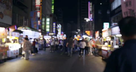 Blurred defocused view of People Walking at Liou He Night Markets in Kaohsiun Stock Footage 241908985