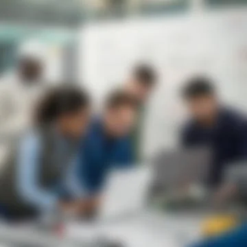 Blurred Diverse Team of Engineers Collaborating on Laptop Stock Photos