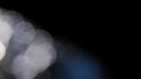 Blurred dots of light on a black background Stock Footage 312574659