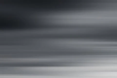 Blurred dramatic grey sky background. Stormy clouds. Stock Photos