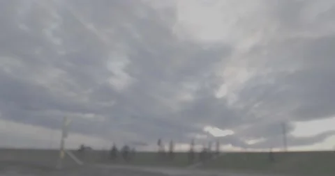Blurred driving evening sun going under a bridge Stock Footage 146807240
