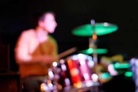 Blurred drummer with drum set. Stock Photos
