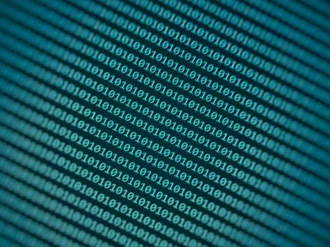 Blurred effect of binary code number background with green and blue mixed col 库存照片