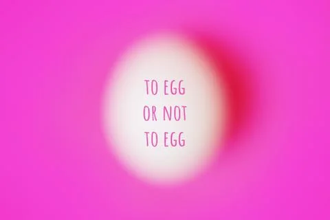 Blurred egg on pink with text Stock Photos