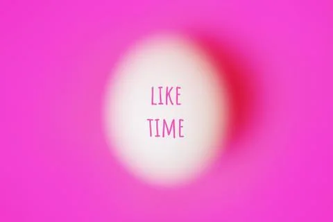 Blurred egg on pink with text Foto stock