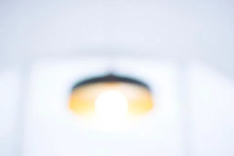 Blurred electric ceiling lamp Stock Photos