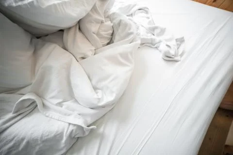 Blurred Empty Bed after wake up in the morning. Stock Photos