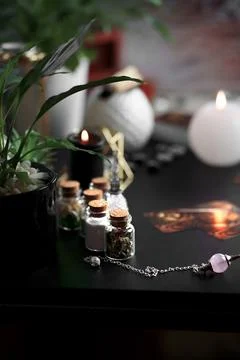 Blurred esoteric magic objects tarot cards on witch table altar Stock Photos