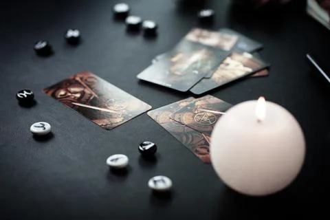 Blurred esoteric magic objects tarot cards on witch table altar Stock Photos