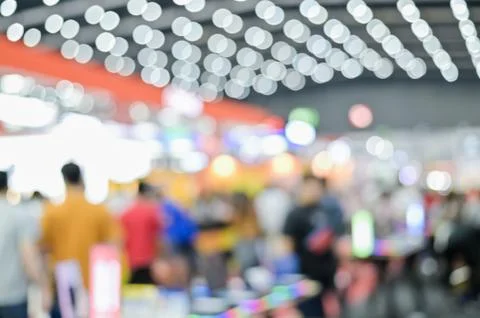 Blurred exhibit showcase background unspecific people Shop in grand sale fair Stock Photos