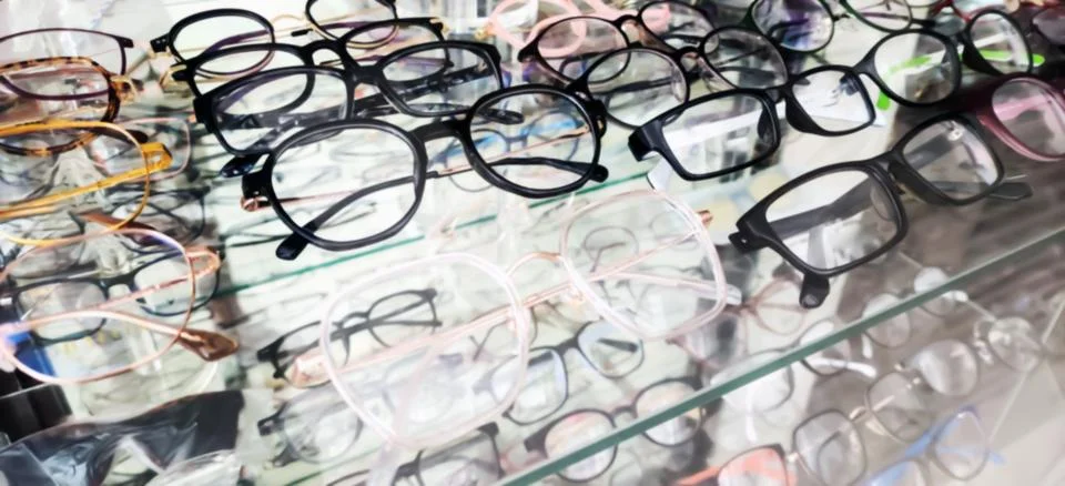 Blurred Eyeglasses Frames Displayed in Optical Store Showcase Stock Photos