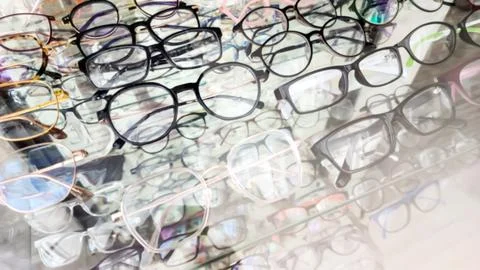 Blurred Eyeglasses Frames Displayed in Optical Store Showcase Stock Photos
