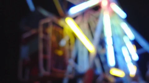 Blurred ferris wheel night scene Stock Footage 78940402