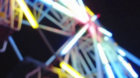Blurred ferris wheel night scene Stock Footage 78940422