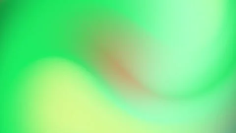 A blurred field shows a smooth gradient of green hues with a reddish streak Stock Footage 294661925