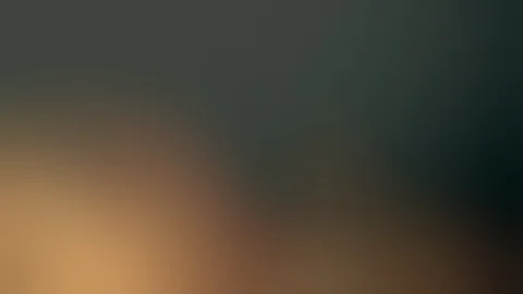 Blurred fire and smoke rising in front of dark green natural background (4K) Stock Footage 127656094