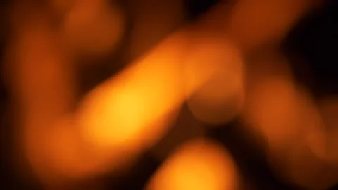 Blurred fire bokeh background in dim light Vidéo 266746177