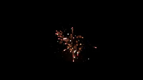 Blurred fireworks explosions on dark background. New Year's Eve celebrations Stock Footage 123778160