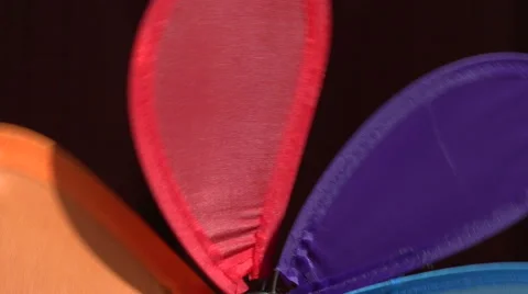 Blurred flashing background of rainbow windmill turning, 4K Stock Footage 65453959