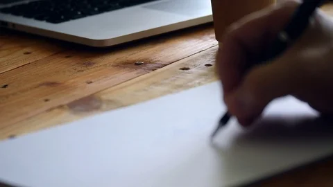 Blurred focus of hand writing notebook 動画素材 105885491