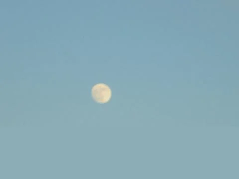Blurred full moon on clear winter sky, close-up Stock Photos