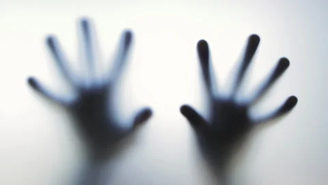 Blurred, ghostly hands pressing and sliding along frosted glass surface Stock Footage 307208500