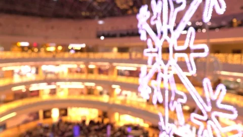 Blurred giant LED snowflake and holiday Christmas lights at the mall. 4K video 動画素材 70581484