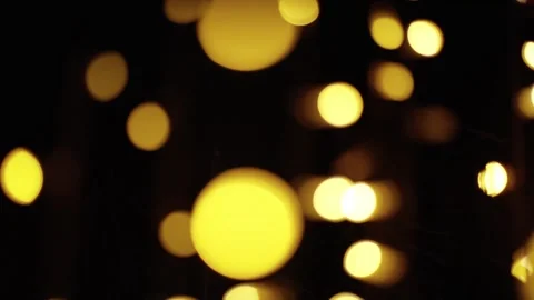 Blurred glowing lights on black background Stock Footage 259193180