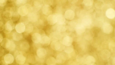 Blurred golden background. Camera movement from left to right. Stock Footage 103940761