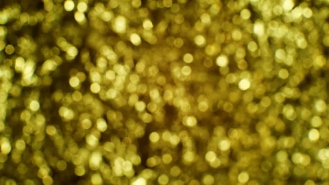 Blurred golden background. Camera movement from bottom to top. Stock Footage 103947016