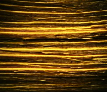 Blurred golden colored striped pattern Stock Photos