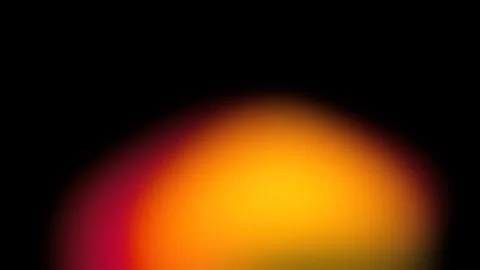 Blurred gradient of warm orange, red, and yellow light on black Stock Illustration