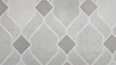 Blurred gray geometric shape wall background. Grey tile floor or wallpaper. Stock Photos
